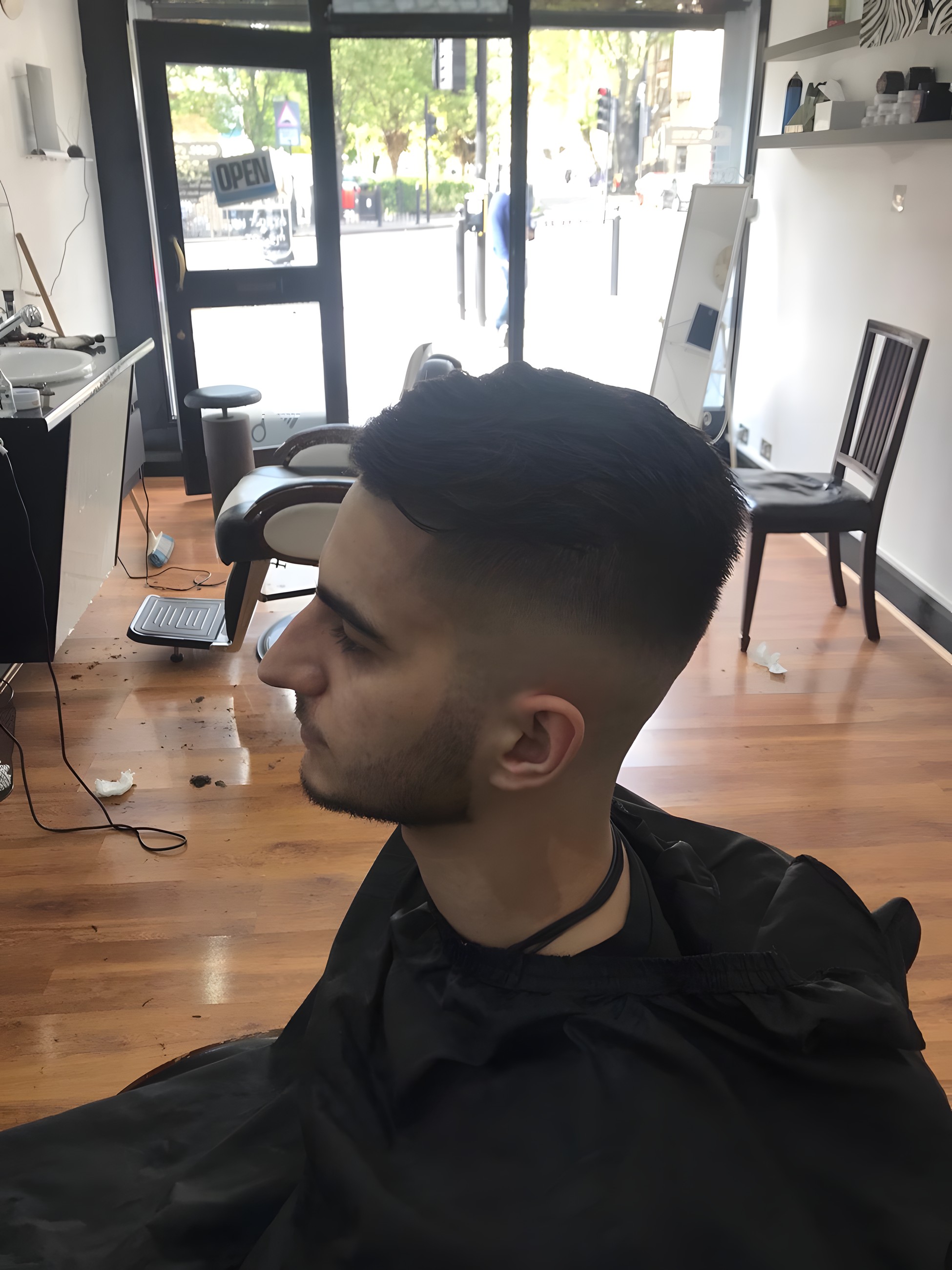 Client in the chair by the shop window